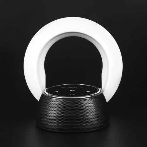 DEAMAK-1 Bluetooth speaker with integrated LED desk lamp showing folding design and touch controls