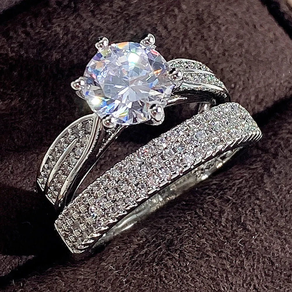 White gold colour geometric wedding combined ring bracelet with round details on a hand.