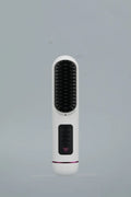 Portable negative ion hair straightening comb in blue, grey, or white, showing handheld size.