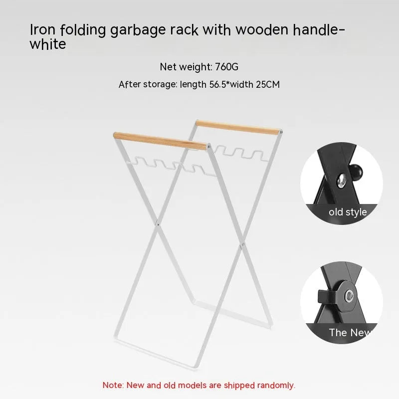 Black iron folding storage rack with a wooden handle for hanging outdoor waste bags.