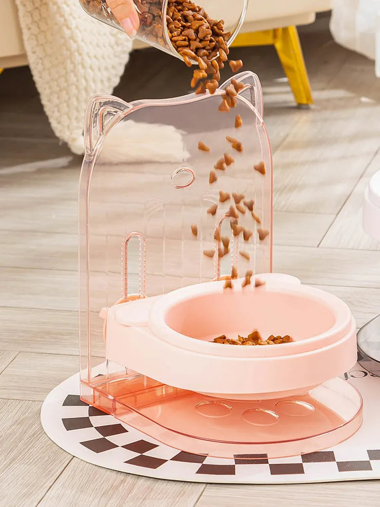 Grey cat ear design pet bowl with removable hanging cage attachment on white background