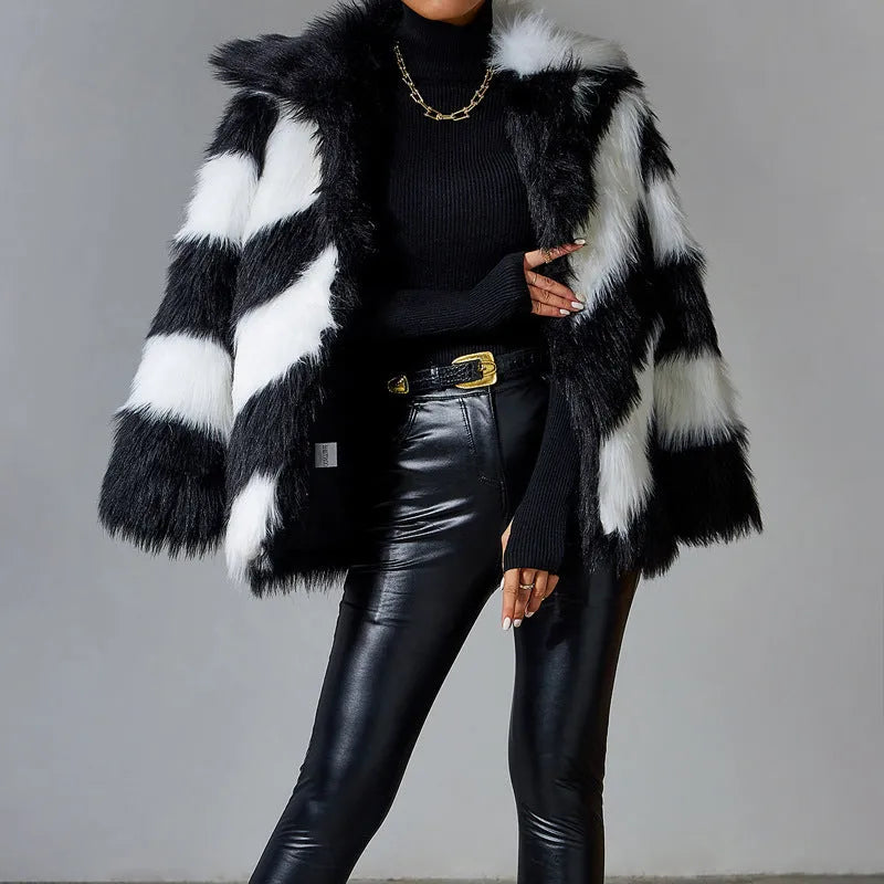 Women's faux fur coat with contrasting lapel detail and a detachable fur collar.
