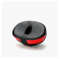 Large red bicycle saddle with reflective stickers, showing thickened design and shock absorber.