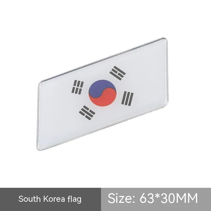 Aluminium parallelogram car sticker with national flag design measuring 6.3 by 3 cm