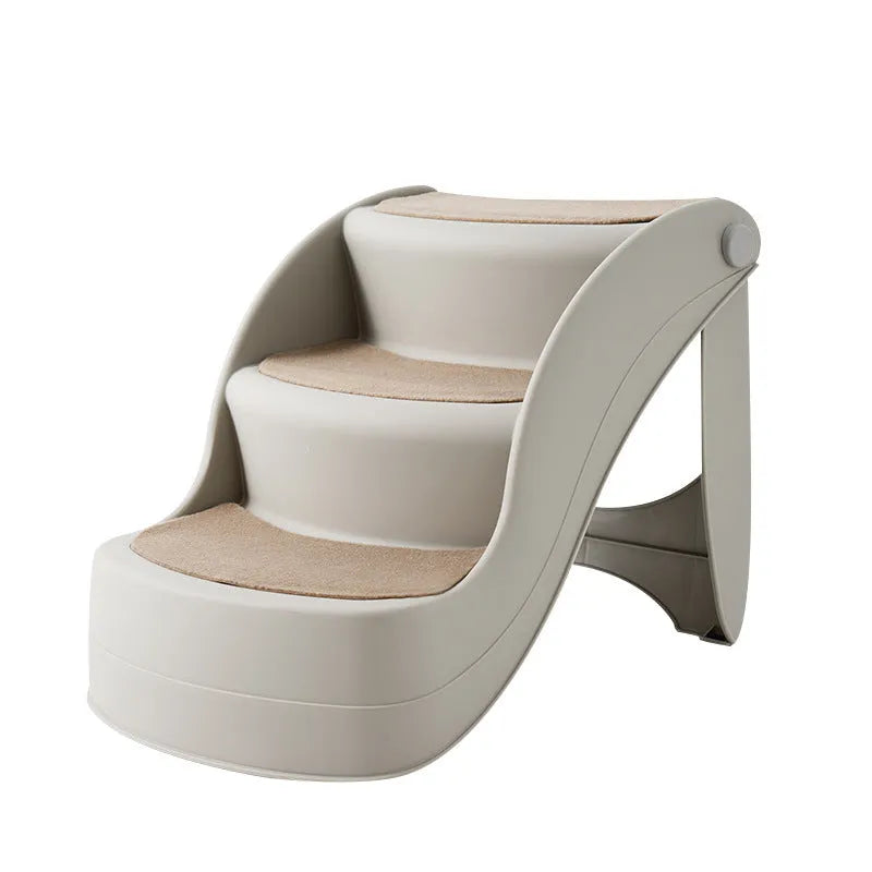 Foldable grey plastic pet stairs for small dogs and cats on a carpeted floor.