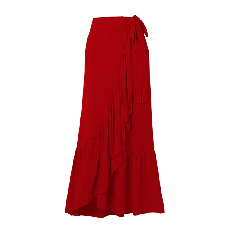 Red women's V-neck one-piece swimsuit with detachable flower and matching skirt on beach