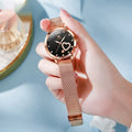Rose gold women's fashion watch with mesh strap showing colour dial options: white, black, blue, red, pink, green.