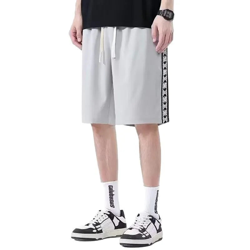 Men's casual baggy track pants in micro-elastic polyester available in sizes M to 5XL