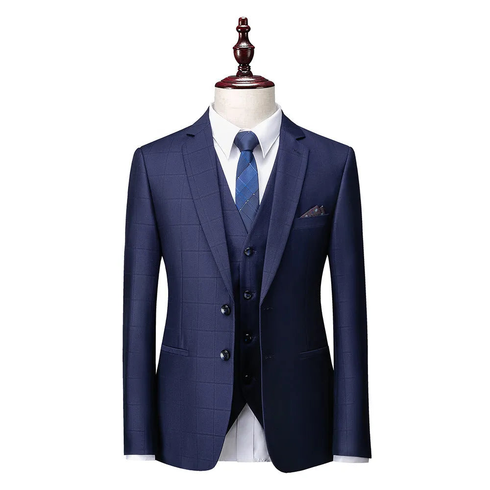 Men's navy blue slim fit plaid three-piece suit with vest, jacket, and trousers on a hanger.