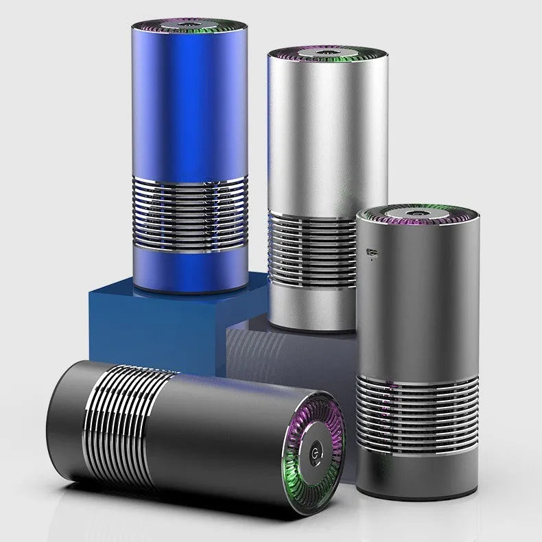 Compact cylindrical car air purifier in metallic grey with aluminium alloy casing.