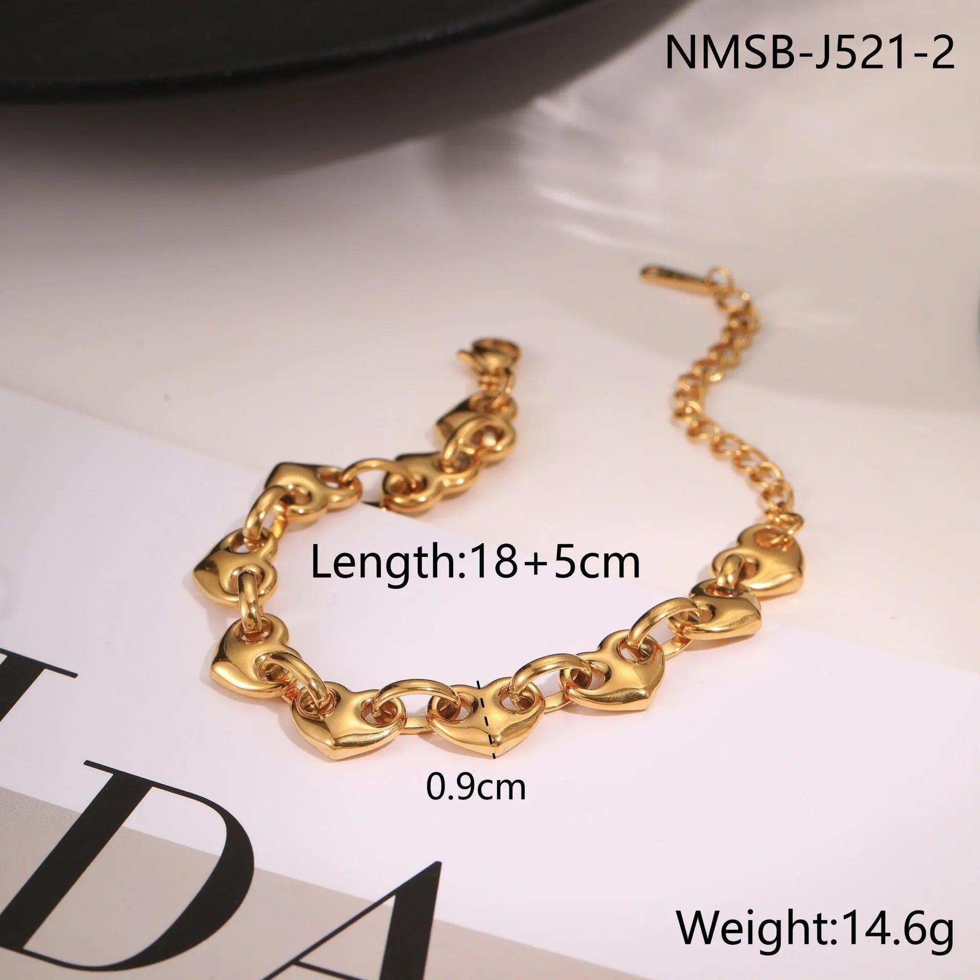 Women's hollowed-out heart bracelet in gold finish with geometric design and stainless steel construction