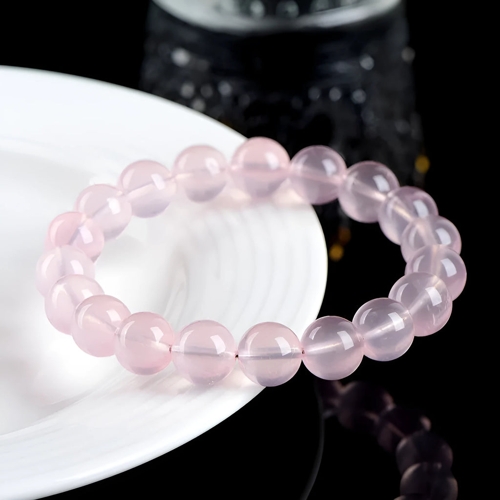 Natural starlight crystal round bead bracelet for women in polished pink with single circle construction
