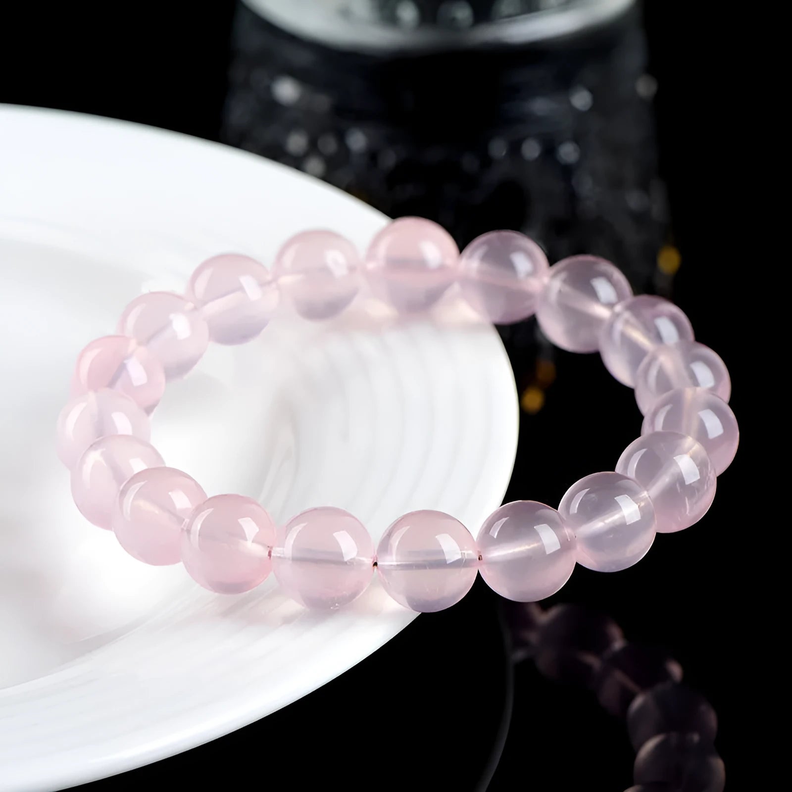 Natural starlight crystal round bead bracelet for women in polished pink with single circle construction