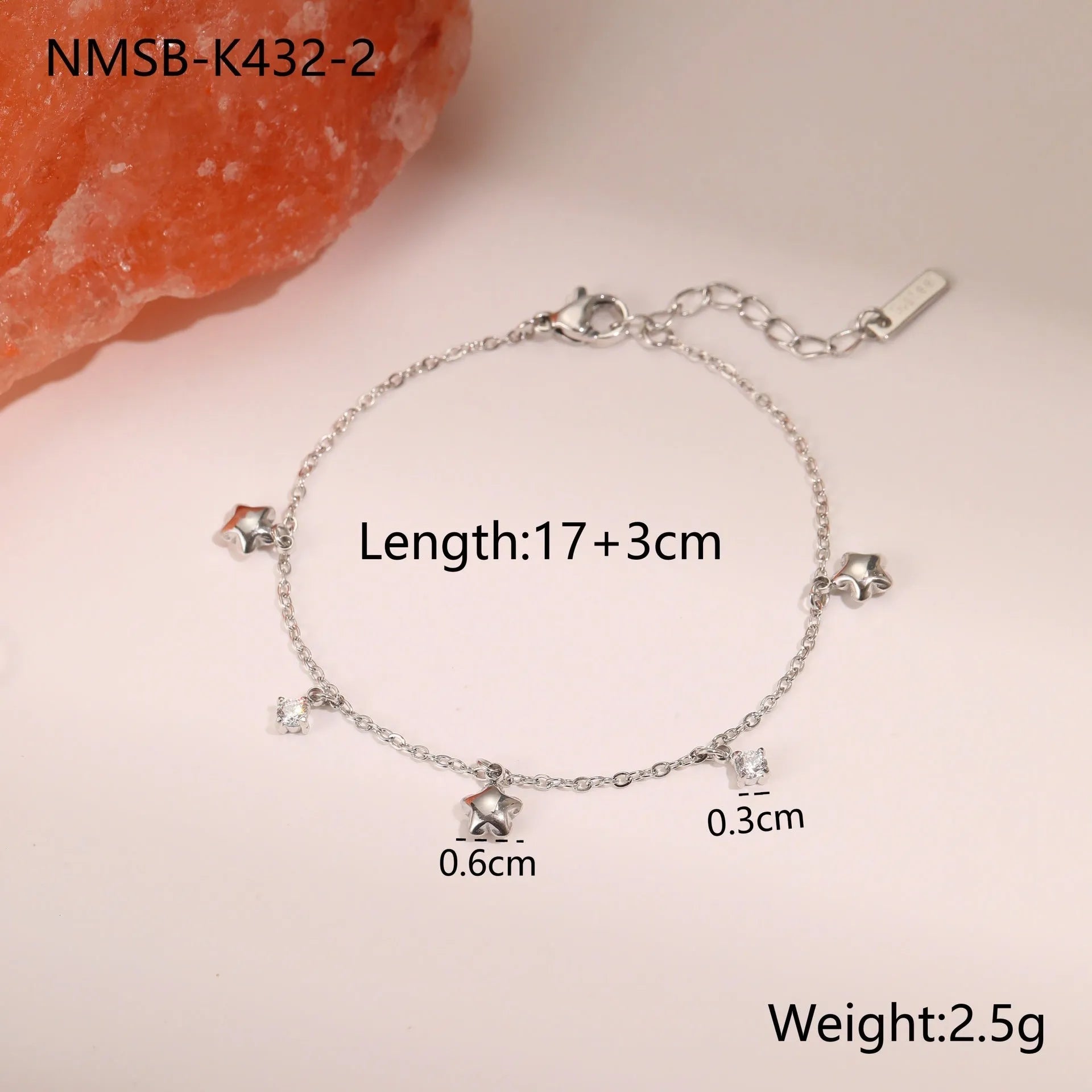 Women's titanium steel bracelet with gold plating and geometric star pendant