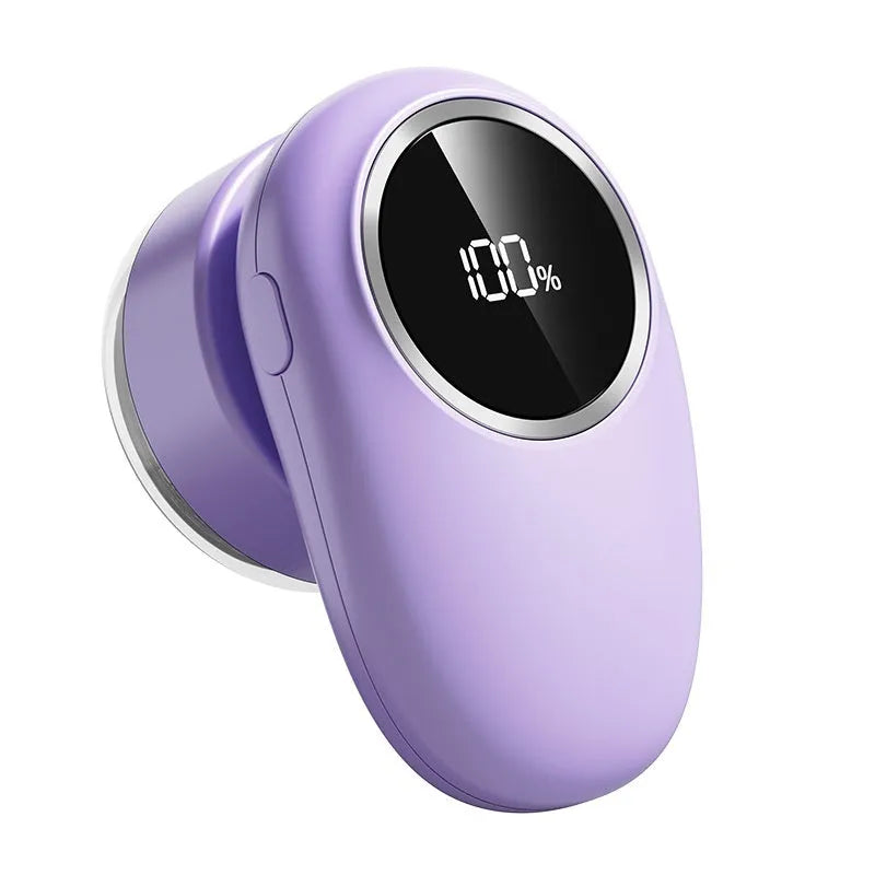 Beige and purple electric fur ball trimmer lint rollers with digital display and rotating cutter heads on a fabric surface.