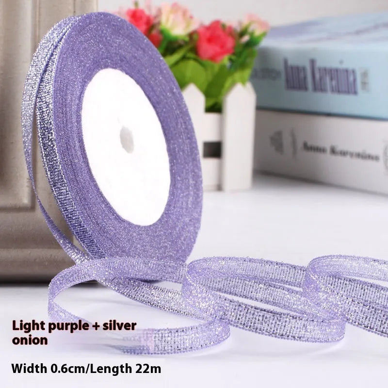Roll of polyester gift ribbon showing 0.6cm width and multiple colour options including metallic finishes