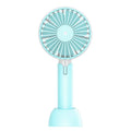 Blue mini USB electric fan with oscillation head and 3 speed controls on desk