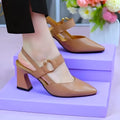 Women's apricot closed toe backless leather sandals with a chunky heel on a rubber sole.