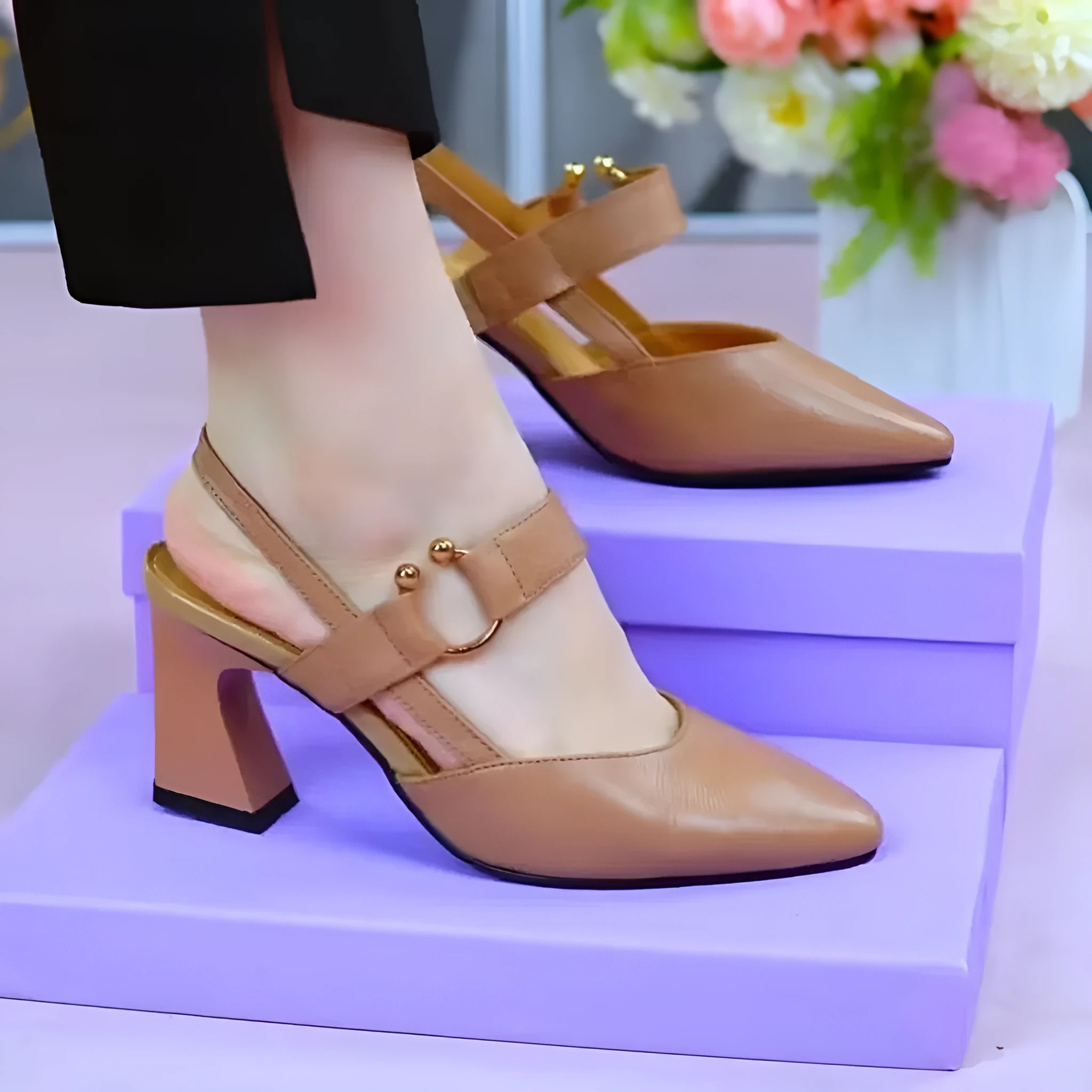 Women's apricot closed toe backless leather sandals with a chunky heel on a rubber sole.