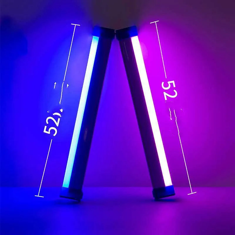 Blue and purple rechargeable LED tube light with USB cable on a dark background.
