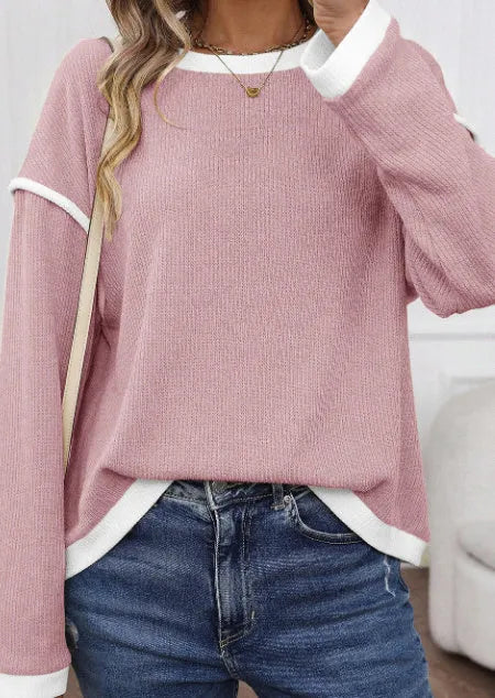 Women's beige knit top with four leaf clover pattern, contrast trim, and drop shoulder loose fit