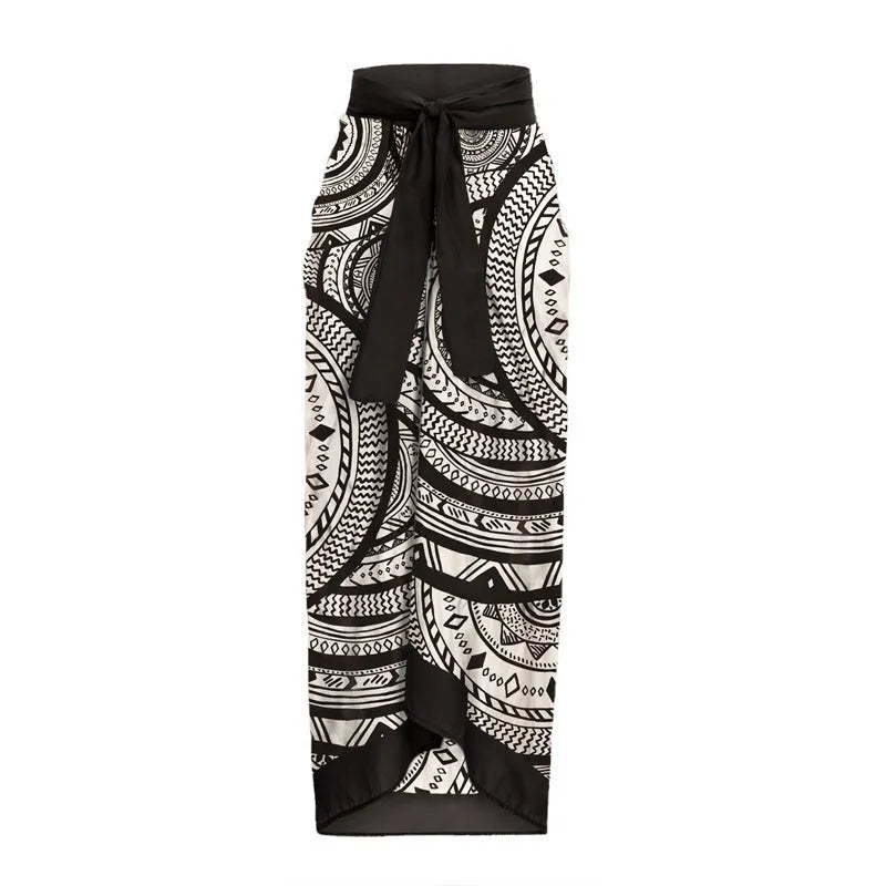 Vintage printed deep V-neck one-piece swimsuit for women with ruffle trim and matching wrap skirt.