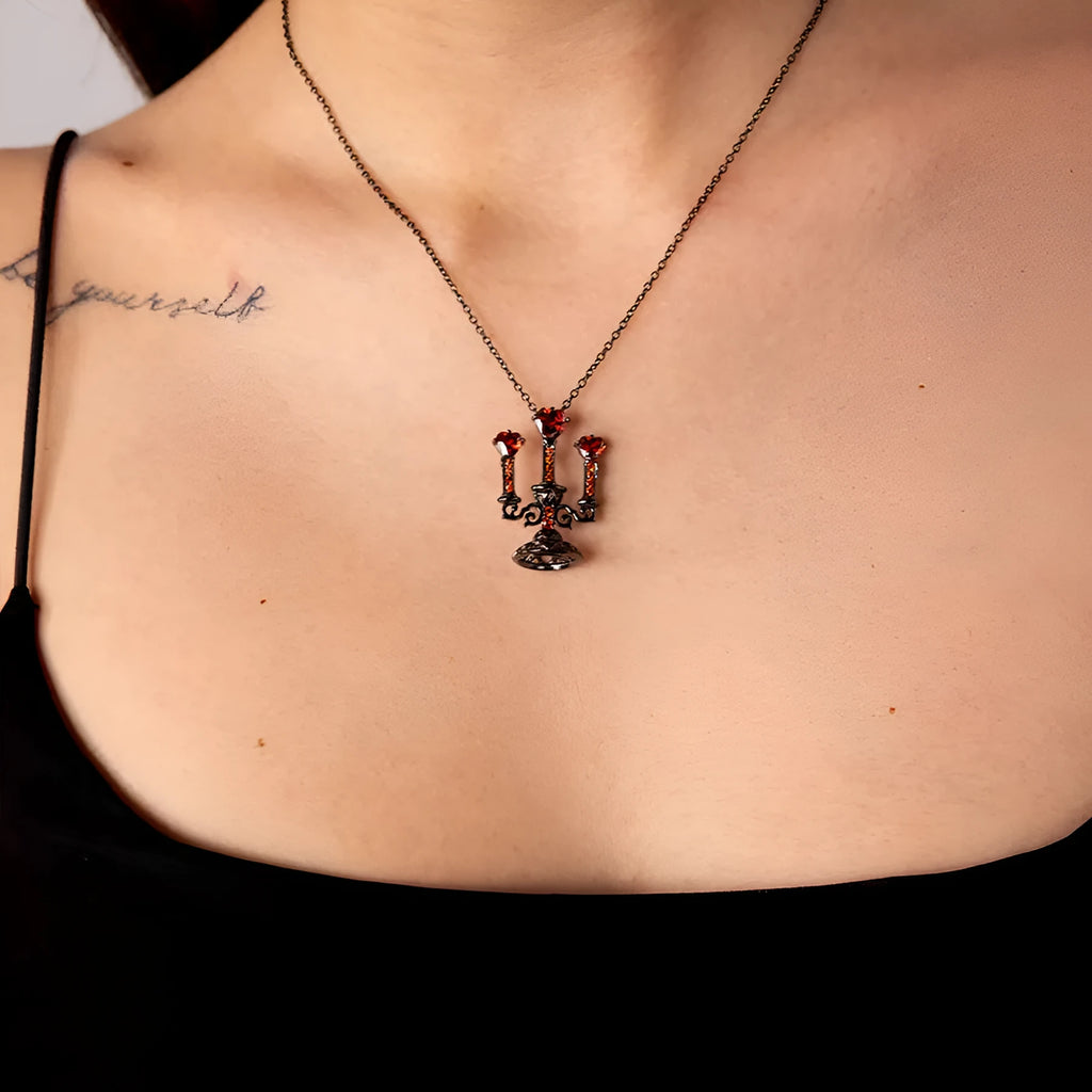 Women's vintage-style necklace with a detailed hollow candlestick pendant and cross chain in zinc alloy.