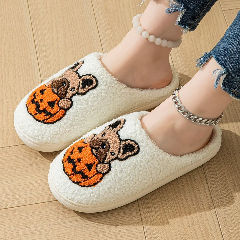 Halloween pumpkin slippers in black or white with plush material and rubber soles