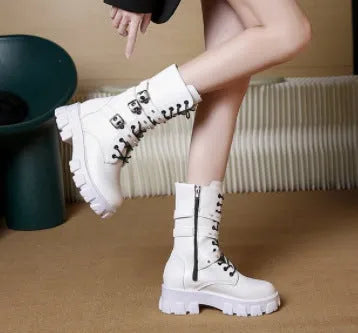 Black women's mid-calf boots with metal buckle detail and a side zip fastening.