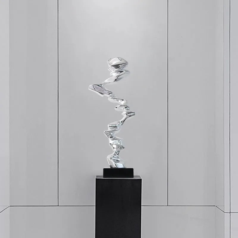 Minimalist abstract resin decorative sculpture in bright gold, silver, or blue.