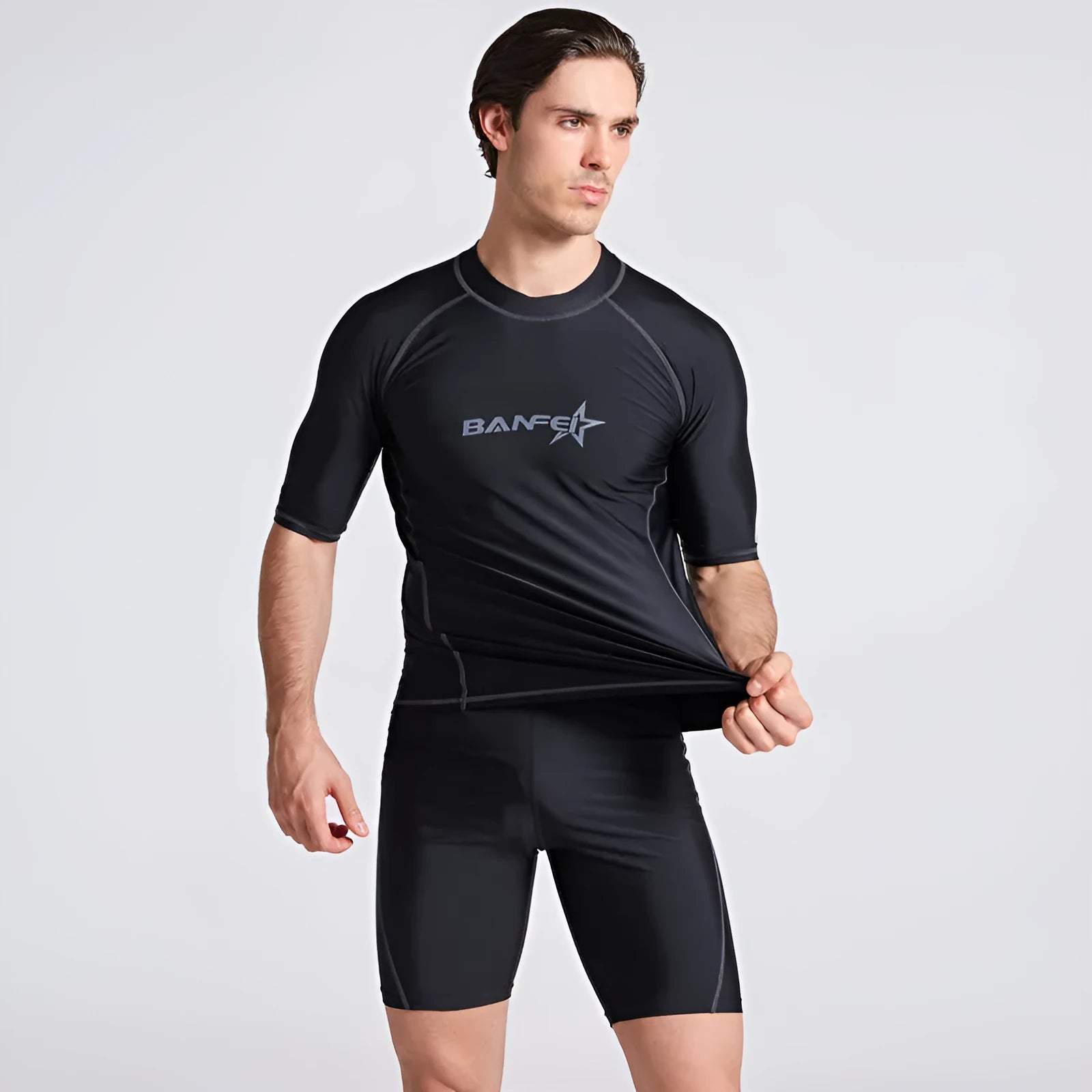 Men's quick-drying half sleeve swim suit with separate swim top and pants in navy blue.