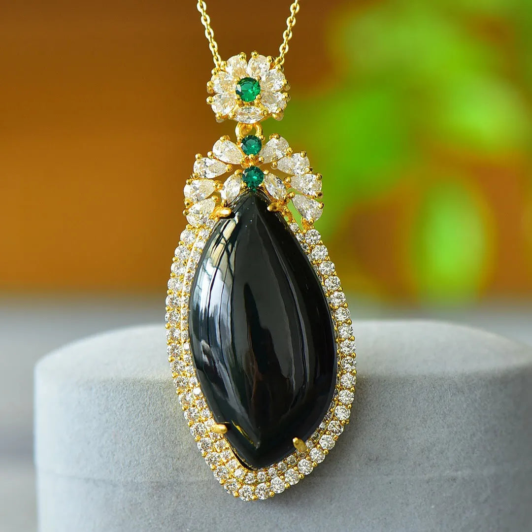 Gray Hetian jade pendant with copper inlay detailing on necklace chain