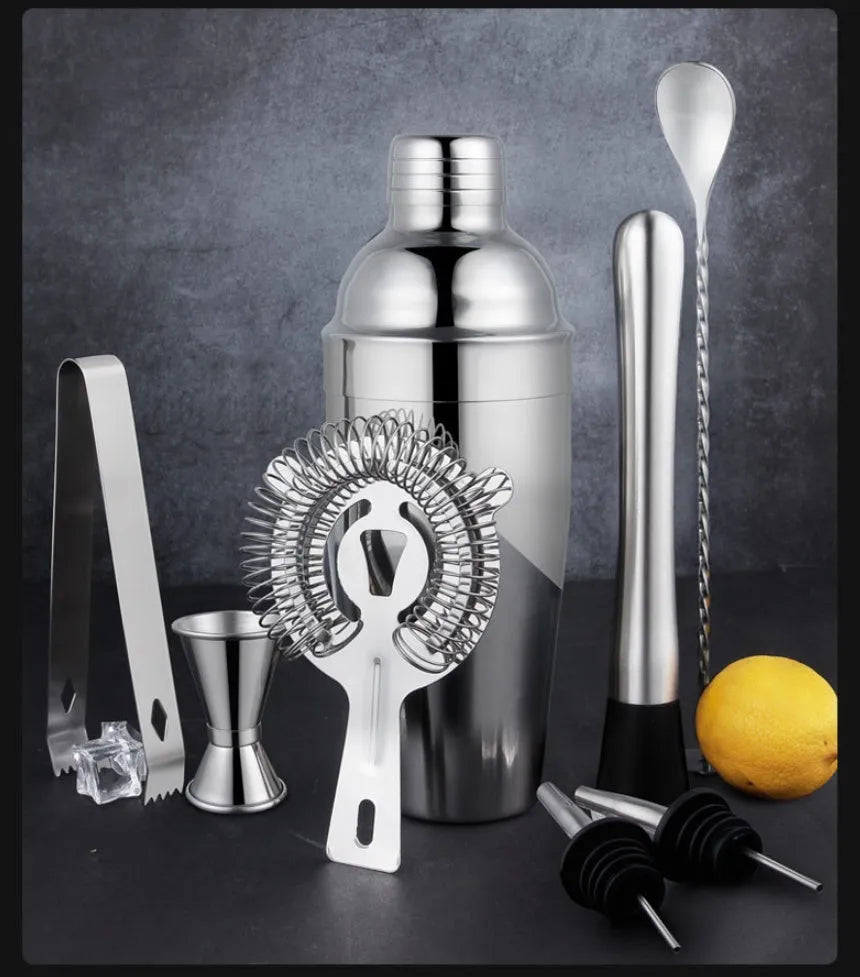 23-piece European style cocktail set with stainless steel bar tools arranged on acrylic display