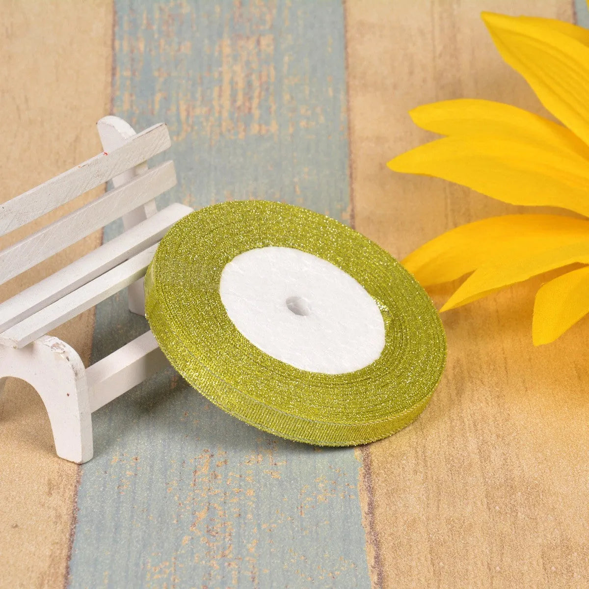 Polyester ribbon spool in metallic colours for decorative clothing and gift packaging trim