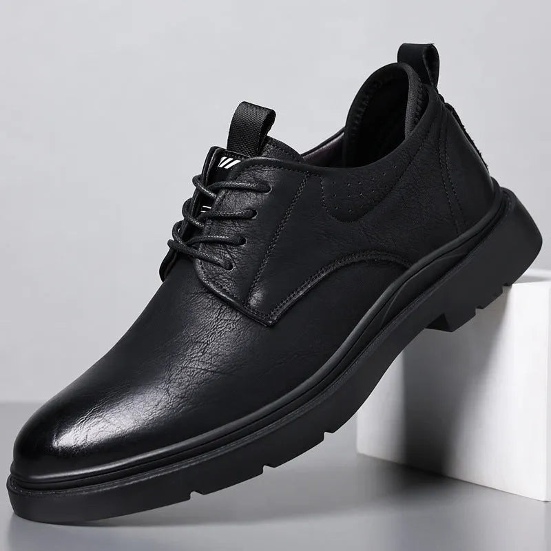 Men's black and brown leather casual sneaker with rubber sole and decorative sewing line detailing