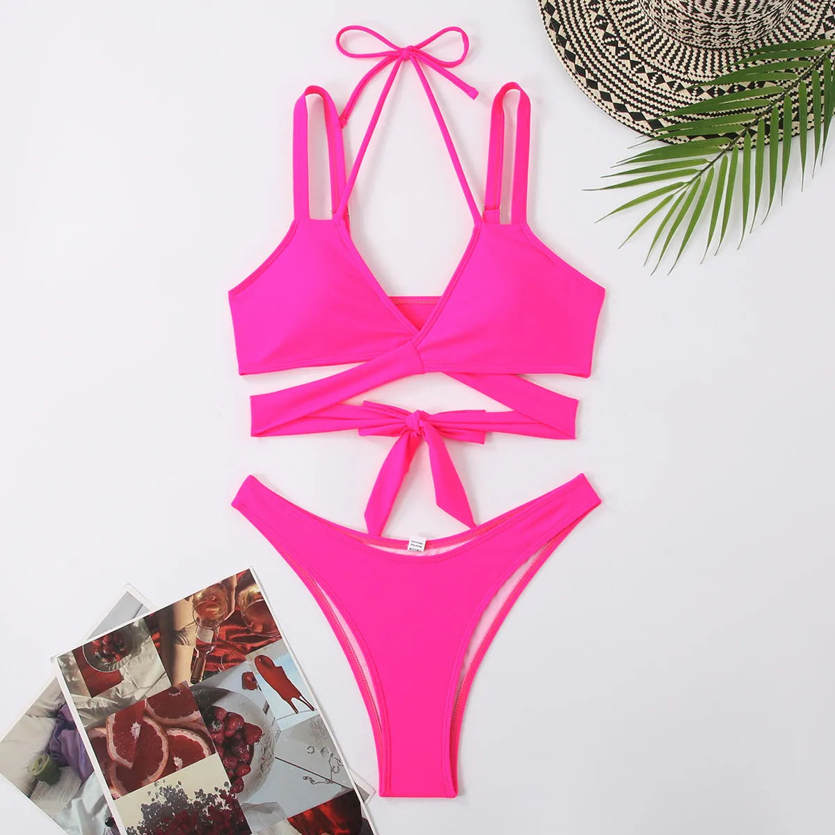 Women's solid colour strap bikini swimsuit in a brief style on a white background.