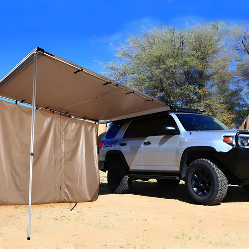Camping tent sunshade with aluminium poles and camouflage or black glue style, set up outdoors.
