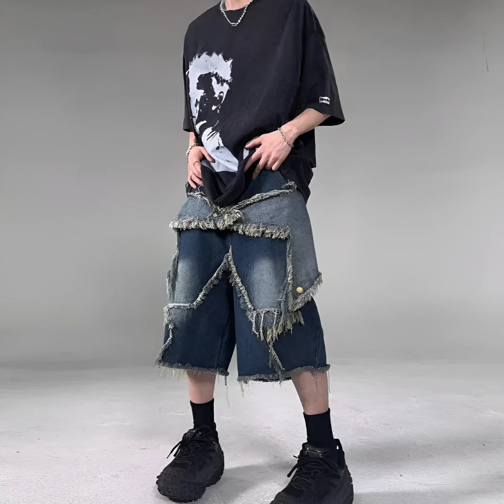Men's blue distressed denim shorts with a large five-pointed star and frayed hem in a loose cargo fit.