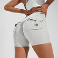 Women's high-waisted fitness shorts with pockets in various solid colours