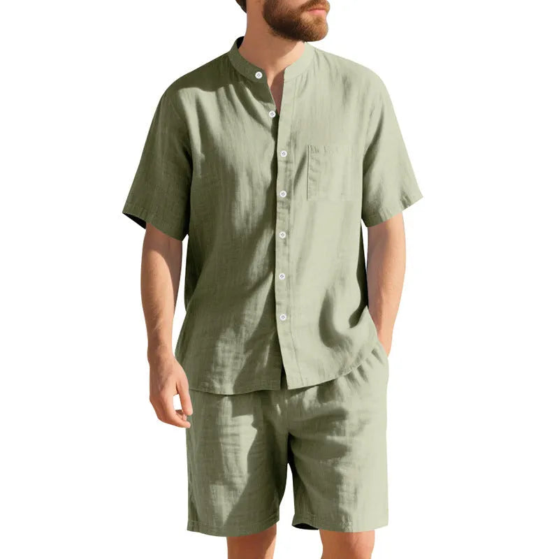 Man wearing a light blue linen blend short sleeve shirt and matching shorts, a casual summer two-piece suit.