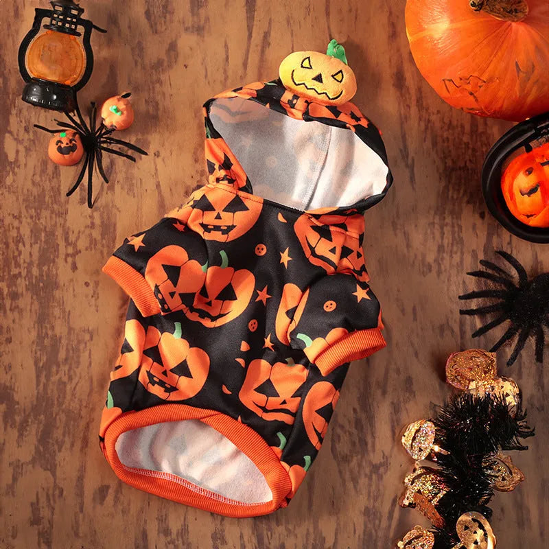 Small dog wearing an orange Halloween pumpkin skirt costume made of crystal velvet