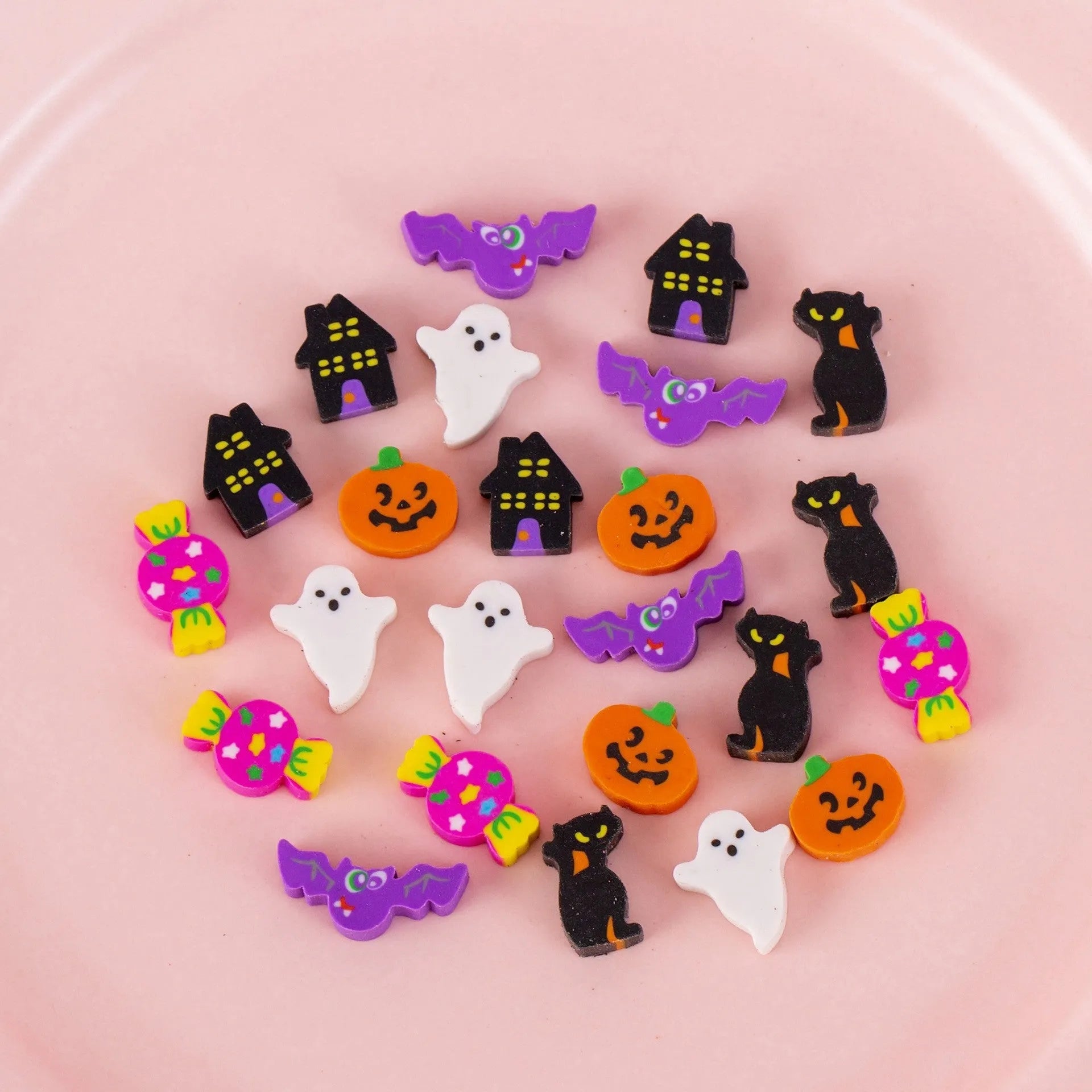 50 colourful cartoon mini erasers in pearlescent bags showing fruit, animal, and holiday designs