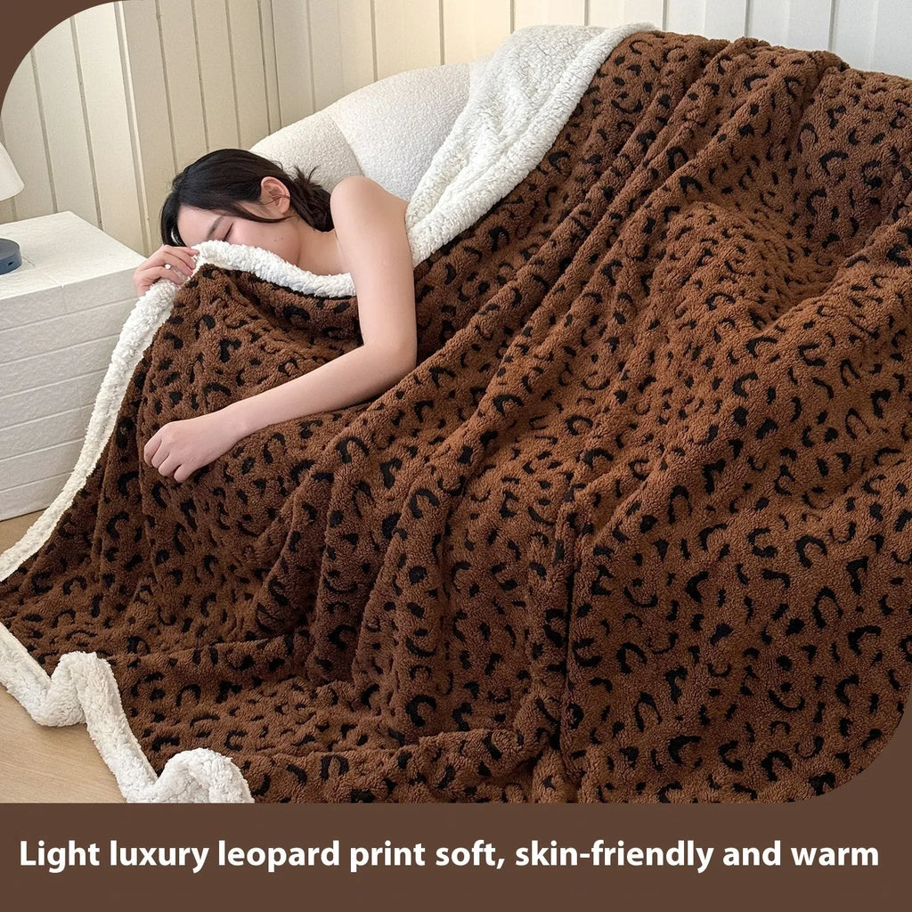 Double-layer Jacquard taffeta blanket with leopard print design in camel colour folded to show texture and pattern detail