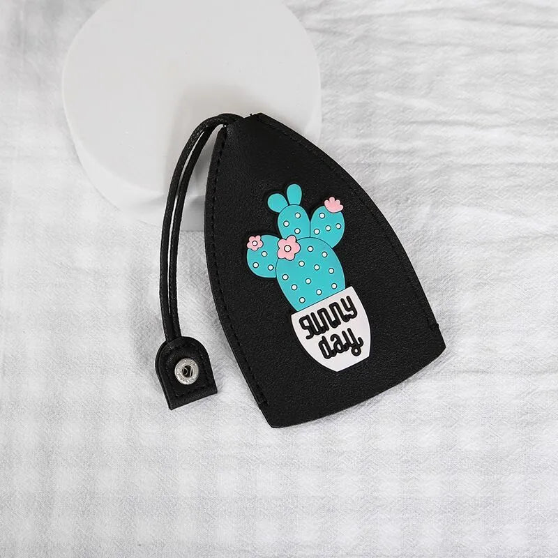 Cartoon pull-out car key case in PU leather with colourful designs measuring 14 x 7.5 cm