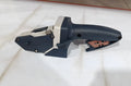 Blue multifunctional woodworking cutter with aluminium blade, TPR handle, and safety lock for dust-free board cutting.