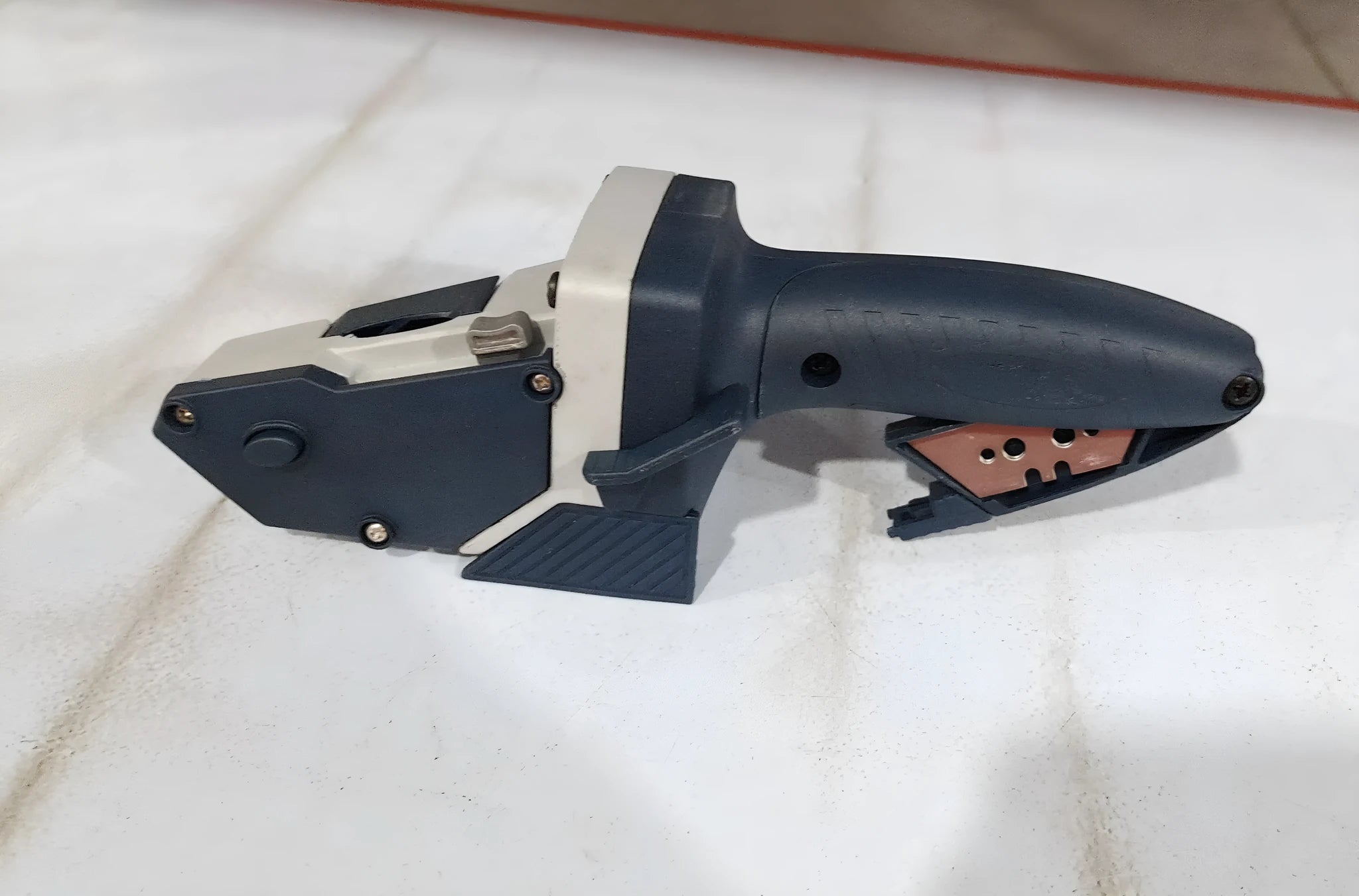 Blue multifunctional woodworking cutter with aluminium blade, TPR handle, and safety lock for dust-free board cutting.