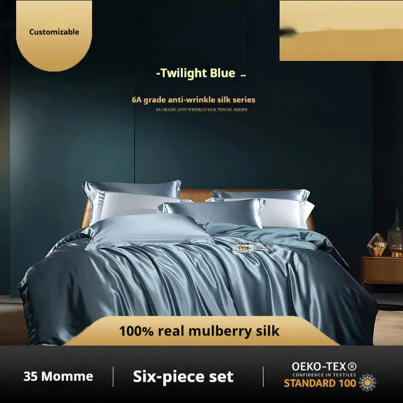 Solid colour silk quilt cover set on a bed in champagne gold, showing flat sheet and pillowcases.