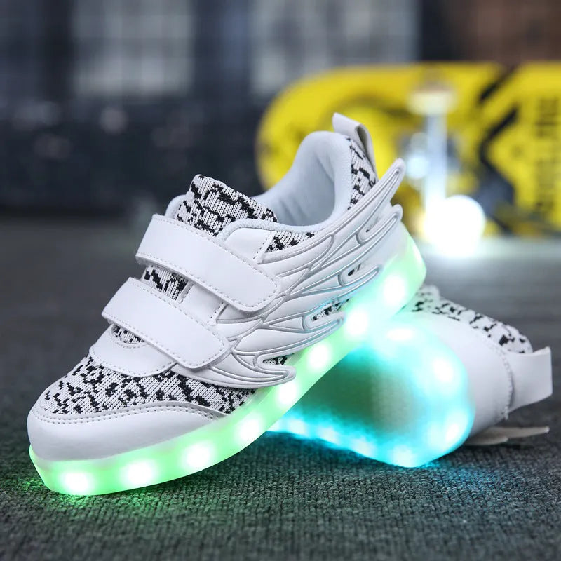 Children's plum red and white LED light-up sneakers with USB charging port and mode switch.