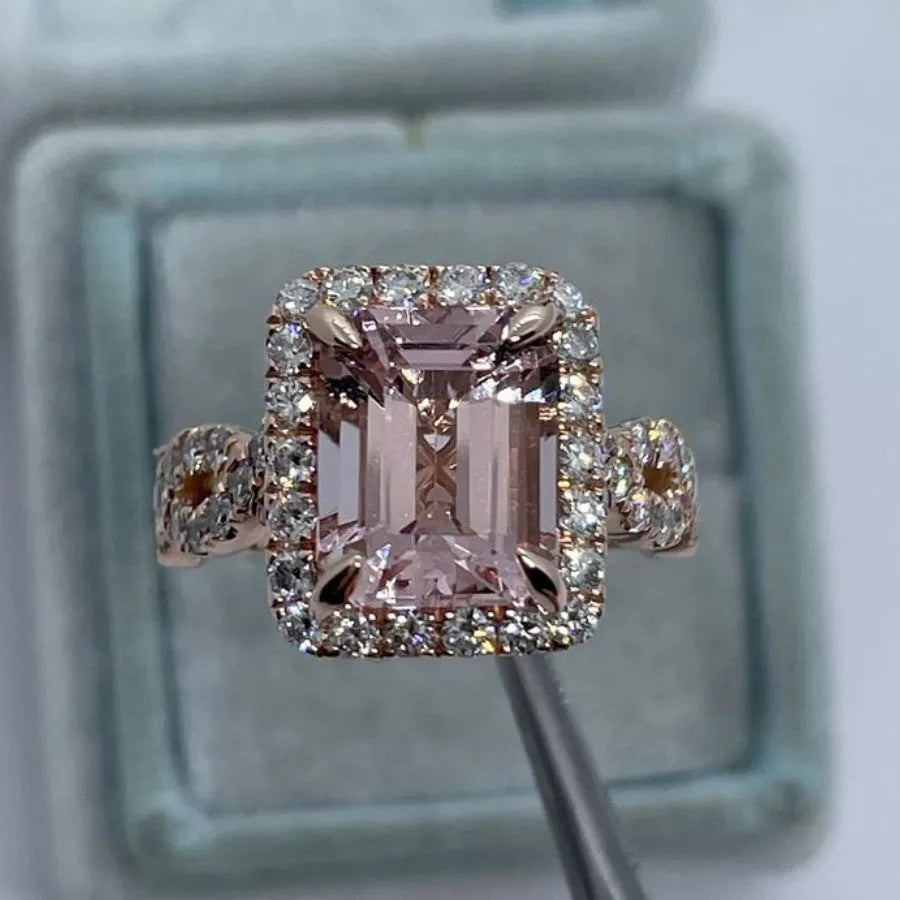 Rose gold electroplated alloy ring with geometrical design shown on hand