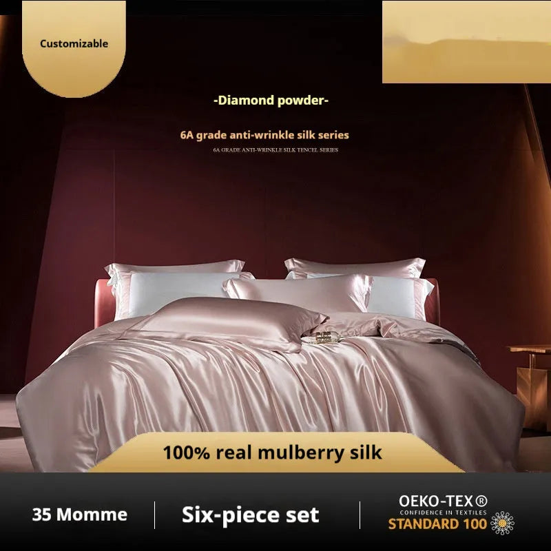 Solid colour silk quilt cover set on a bed in champagne gold, showing flat sheet and pillowcases.